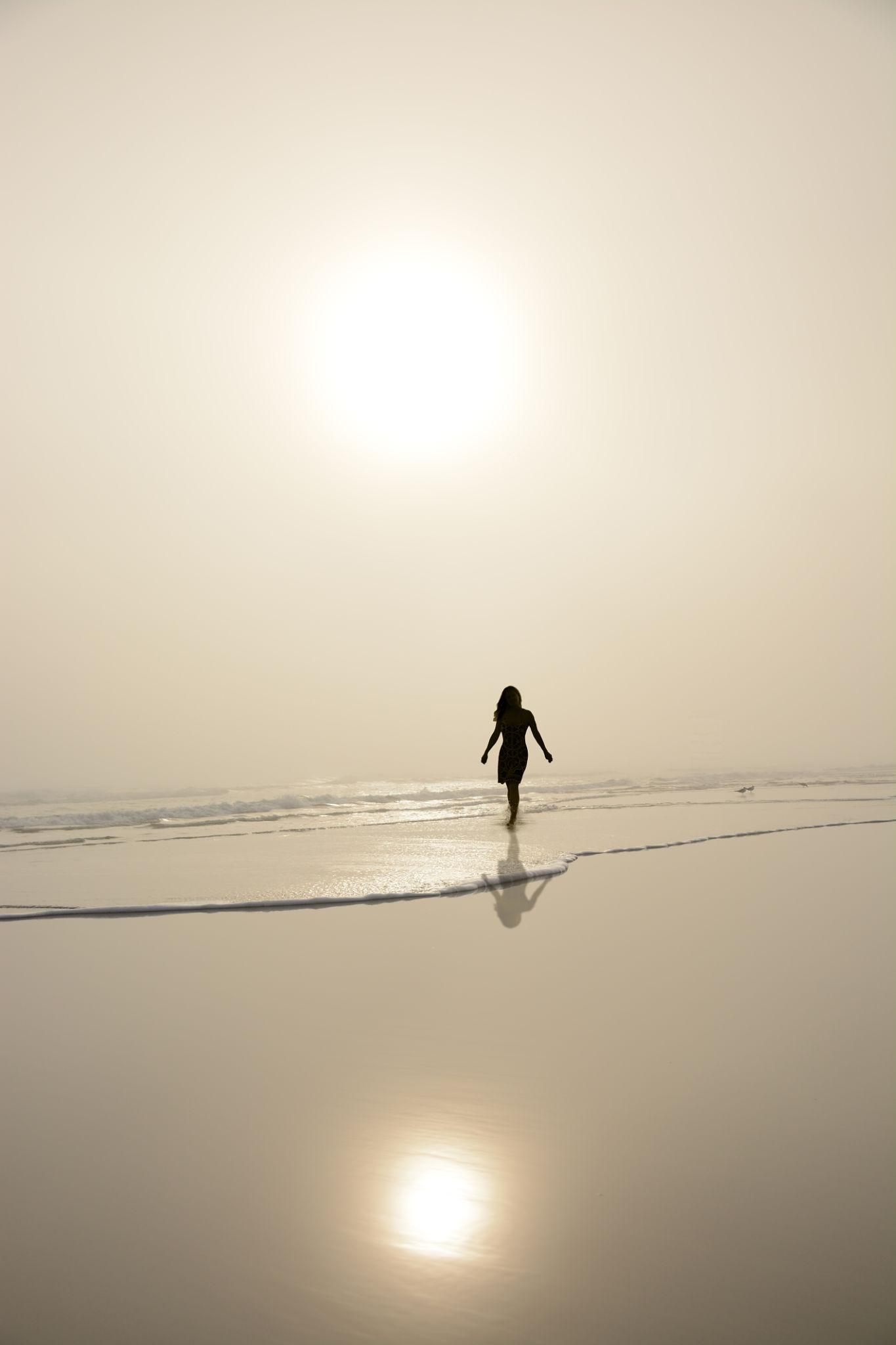 woman enjoying beach with freedom and confidence outdoors