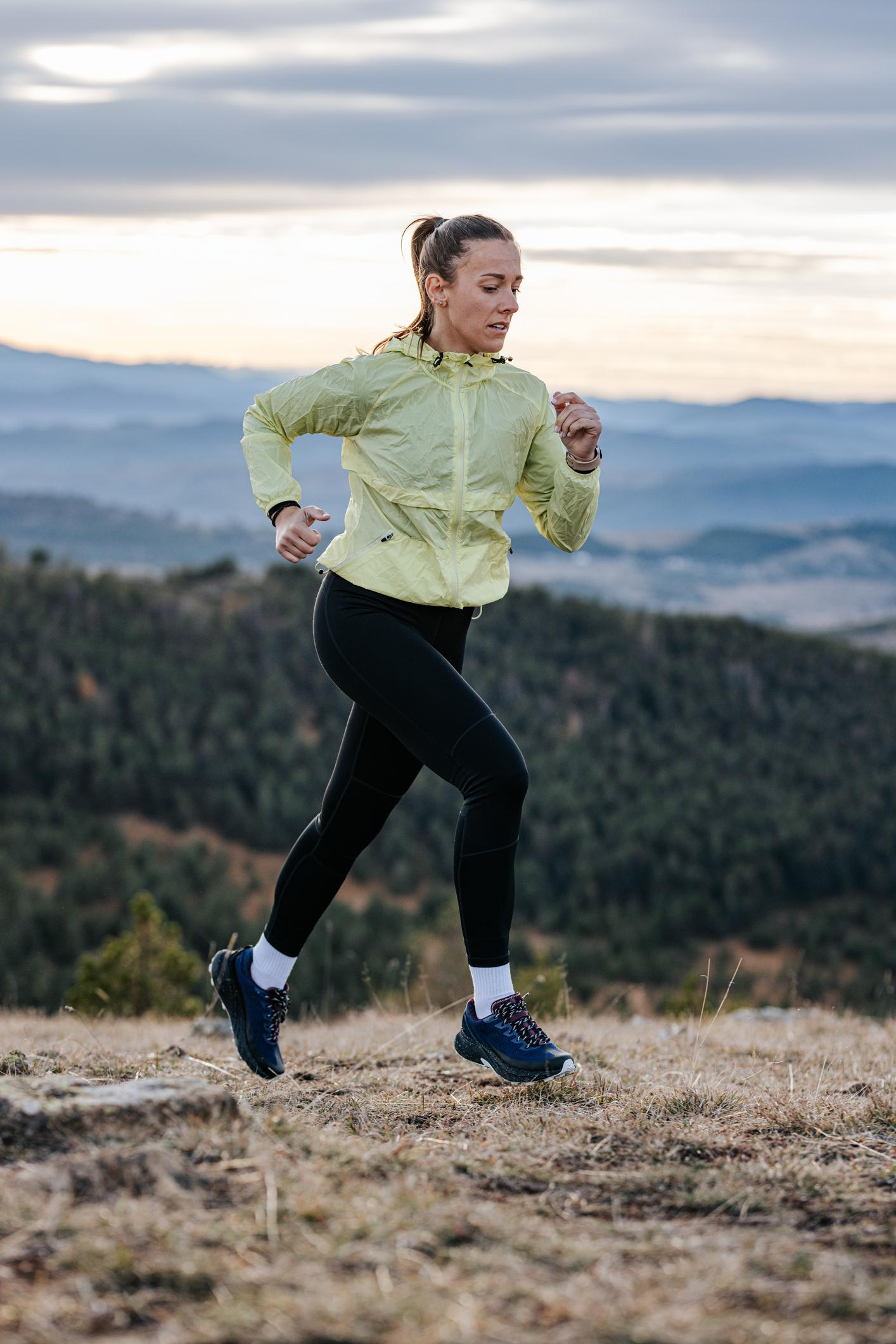 woman jogging with confidence outdoors